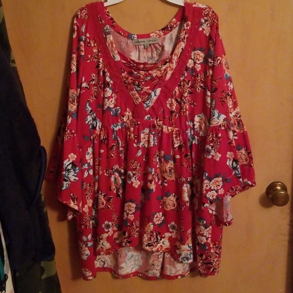 Cute red top with coral and turquoise flowers.